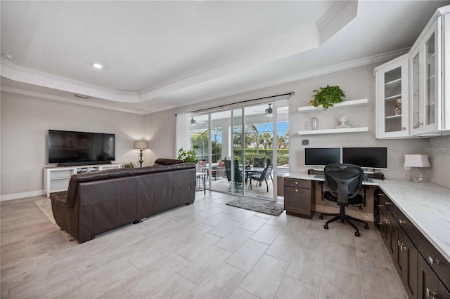 office featuring a tray ceiling and crown molding