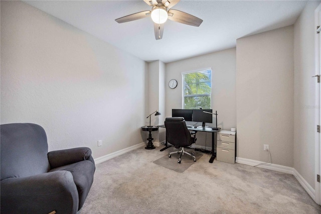 carpeted office featuring ceiling fan