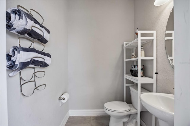 bathroom featuring toilet and sink