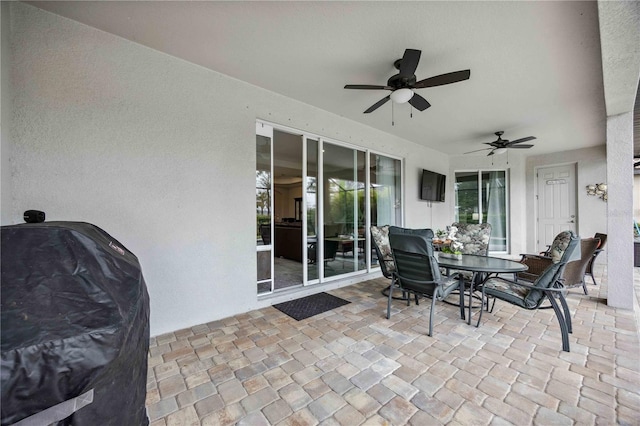 view of patio / terrace featuring ceiling fan and grilling area