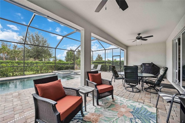 sunroom / solarium featuring ceiling fan and a pool