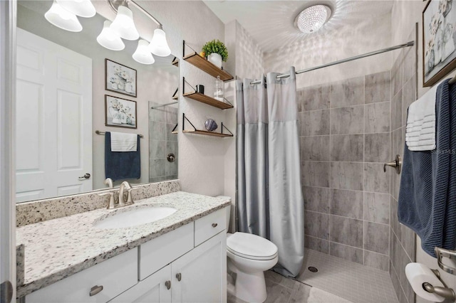 bathroom with vanity, toilet, and walk in shower