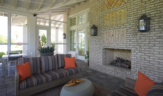 sunroom / solarium featuring beam ceiling