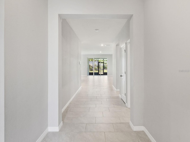 5719 Woodland Sage Dr, Sarasota, FL 34238 - hall with light tile patterned floors and baseboards