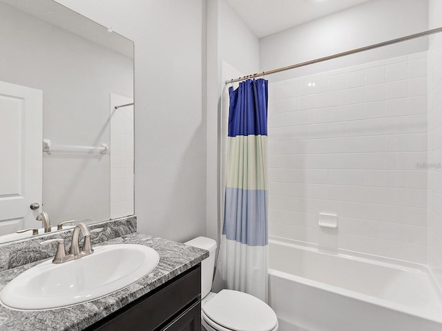 full bathroom with vanity, toilet, and shower / tub combo