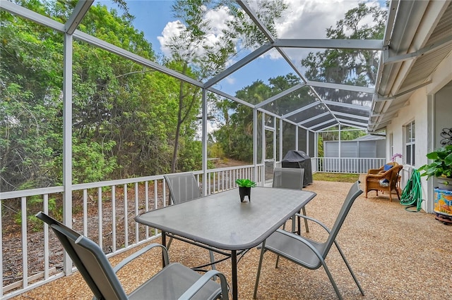 view of patio / terrace featuring a lanai and a grill