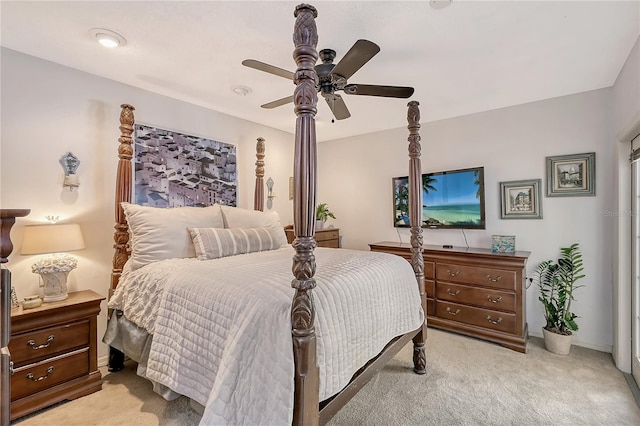 bedroom featuring ceiling fan and light carpet