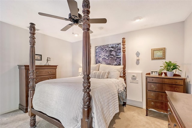 bedroom featuring light colored carpet and ceiling fan