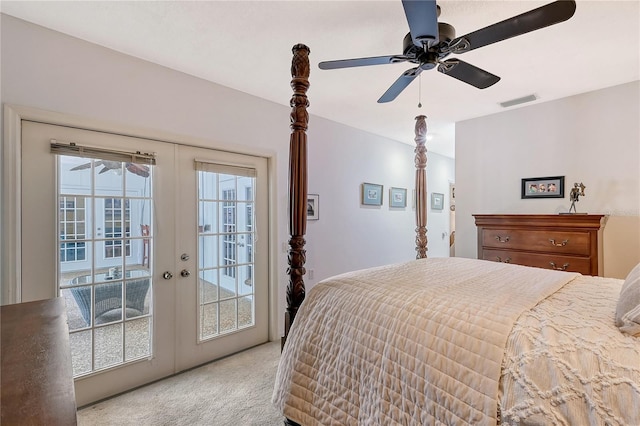 carpeted bedroom featuring french doors, multiple windows, access to exterior, and ceiling fan