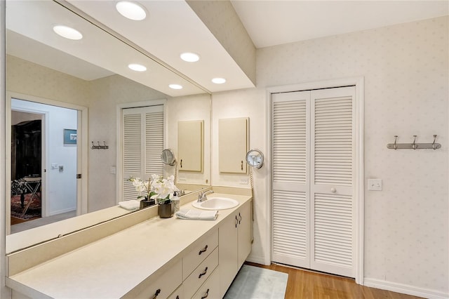 bathroom with vanity and hardwood / wood-style floors