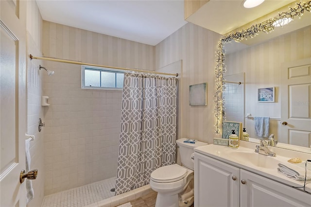 bathroom with vanity, toilet, tile patterned floors, and a shower with curtain