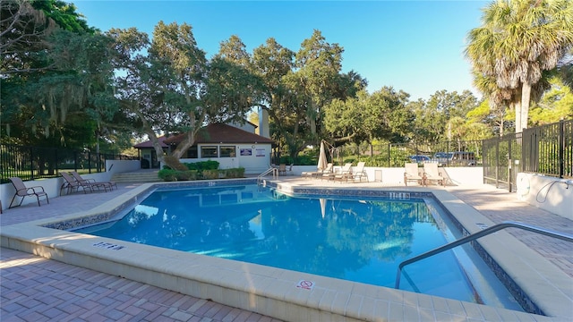 view of swimming pool with a patio