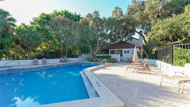 view of pool featuring a patio area