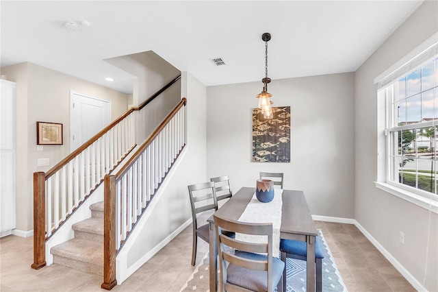 dining area with light tile patterned flooring