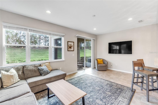 living room with light tile patterned flooring