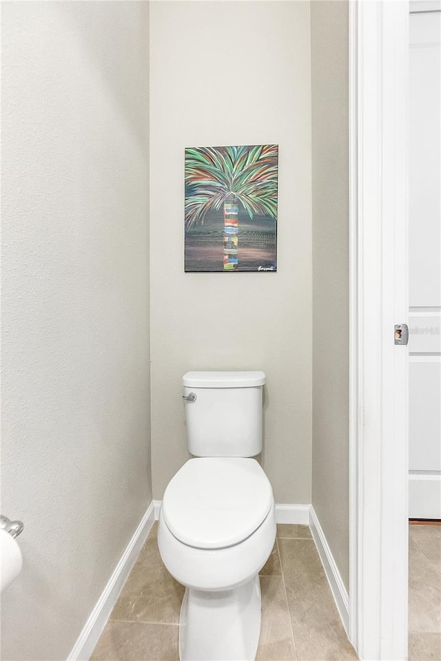 bathroom featuring tile patterned floors and toilet