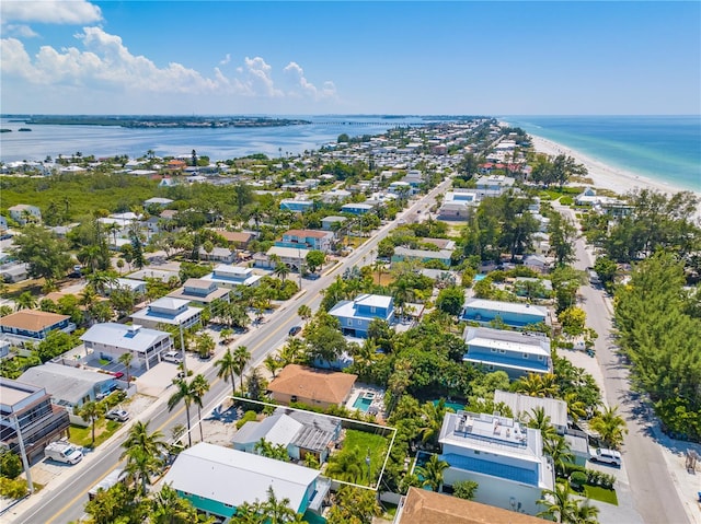 aerial view featuring a water view and a view of the beach