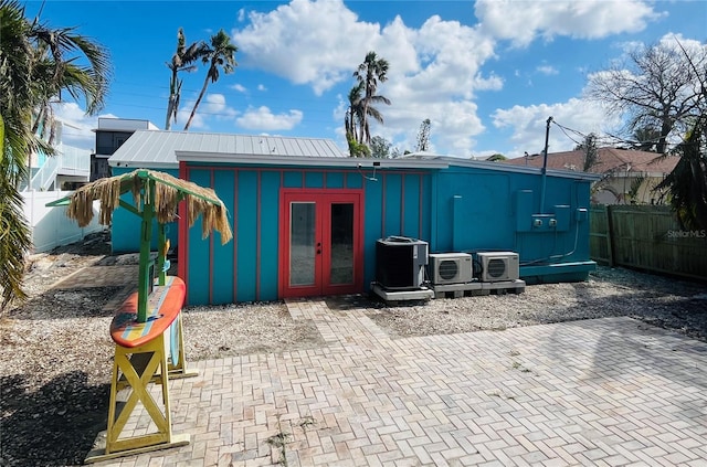 view of outbuilding with french doors and cooling unit