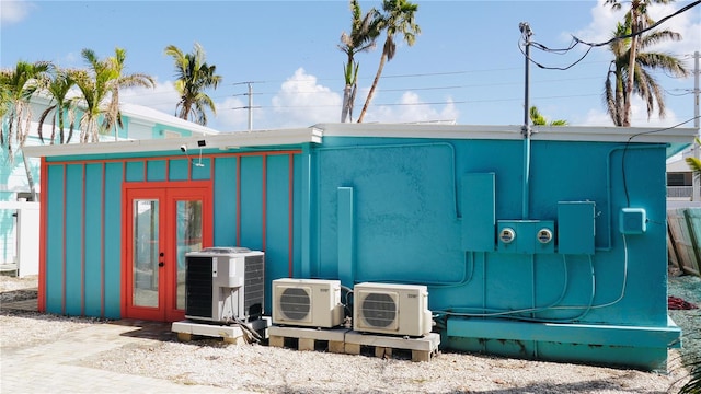 view of outbuilding featuring central AC and ac unit