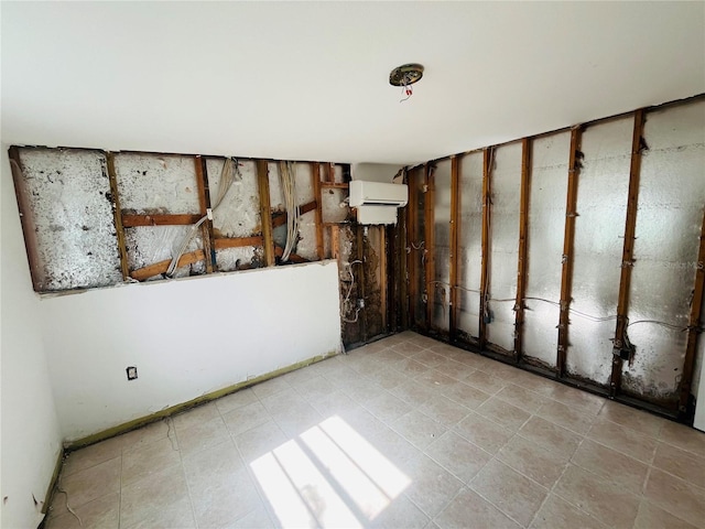 spare room featuring an AC wall unit