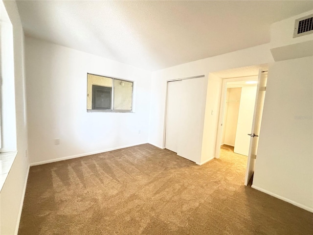 unfurnished room featuring carpet flooring