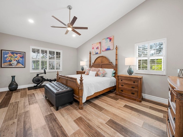 bedroom with high vaulted ceiling, light wood-type flooring, and ceiling fan