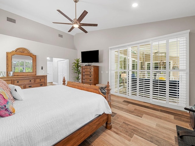 bedroom featuring vaulted ceiling, light hardwood / wood-style floors, and ceiling fan