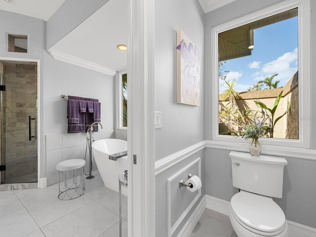 bathroom featuring crown molding, shower with separate bathtub, and toilet