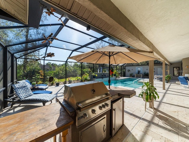 view of patio / terrace with grilling area and a lanai