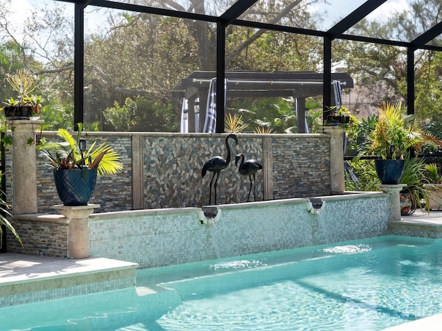 view of pool with a lanai