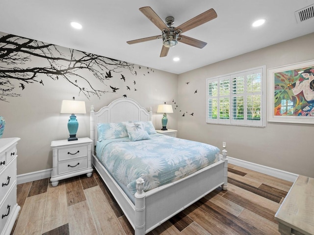 bedroom featuring light hardwood / wood-style floors and ceiling fan