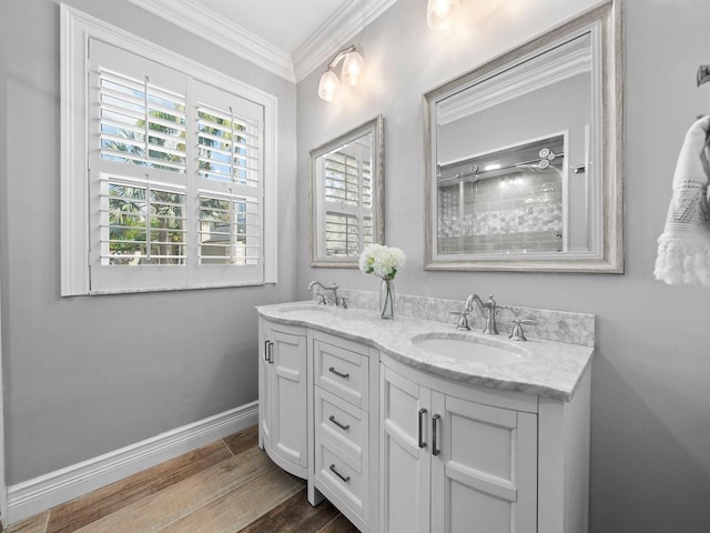 bathroom with vanity, crown molding, and wood-type flooring