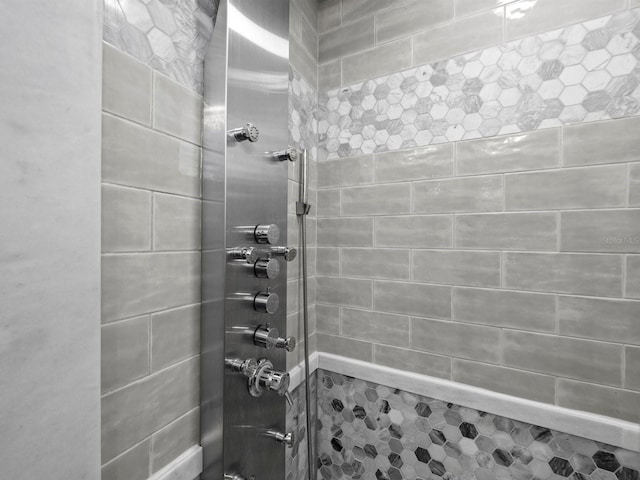 bathroom with tiled shower