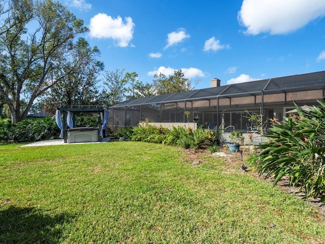 view of yard featuring glass enclosure