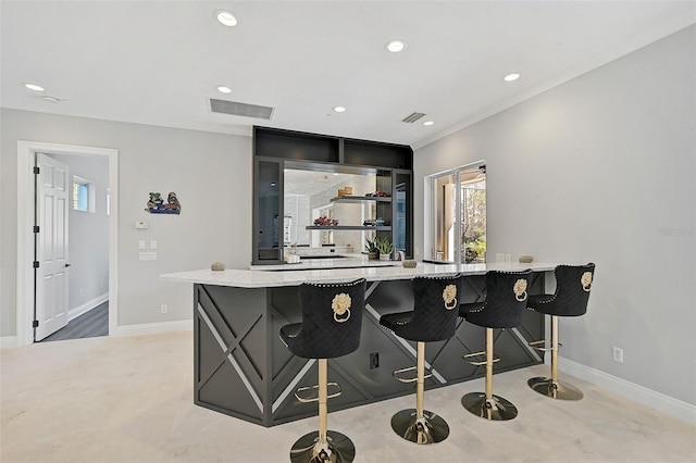 kitchen featuring a kitchen breakfast bar and kitchen peninsula