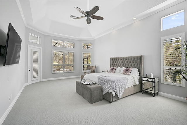 bedroom with ornamental molding, carpet, and ceiling fan