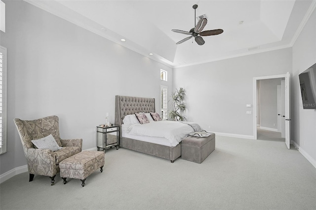 bedroom featuring carpet flooring, a raised ceiling, ceiling fan, and crown molding