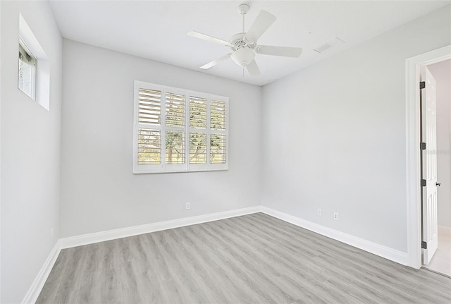 spare room with ceiling fan and light hardwood / wood-style flooring