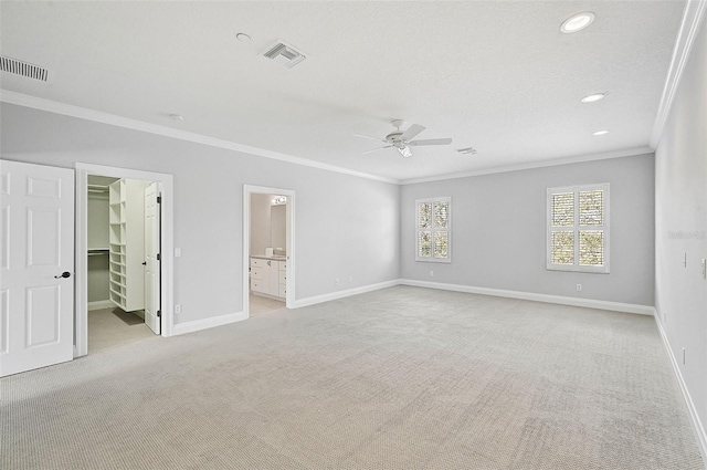 interior space featuring ceiling fan and ornamental molding