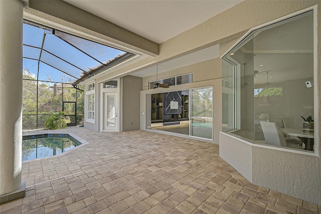 view of pool featuring ceiling fan, a lanai, and a patio area