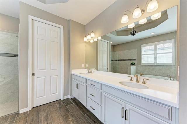 bathroom featuring vanity and separate shower and tub