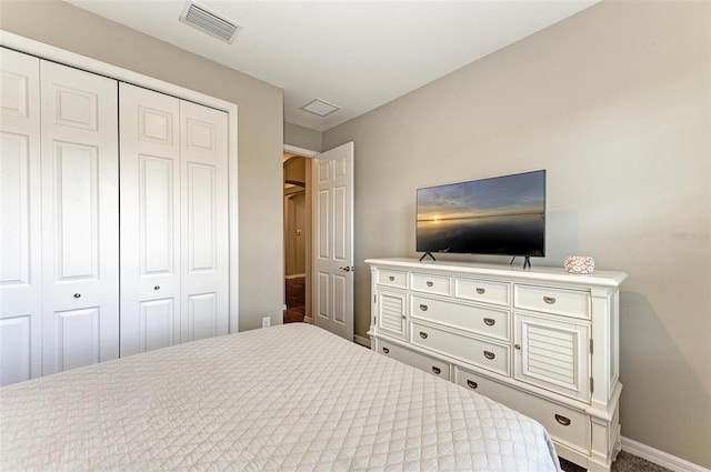 carpeted bedroom with a closet