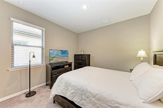 bedroom featuring light colored carpet