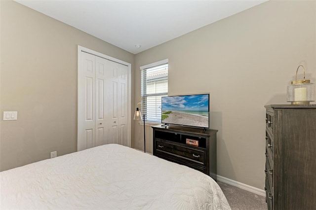 bedroom with a closet and carpet floors