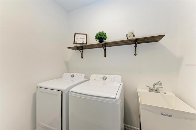 laundry room with sink and washing machine and clothes dryer