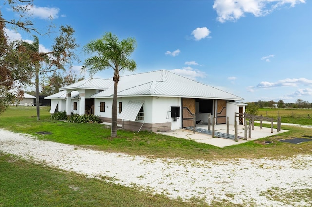 view of front facade with an outbuilding