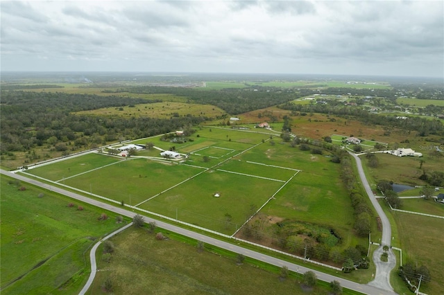 birds eye view of property with a rural view