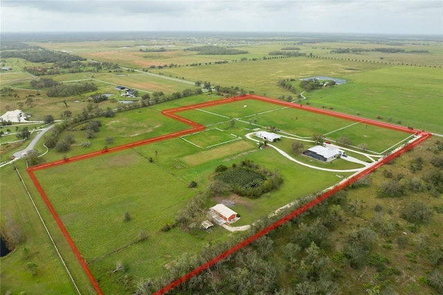 birds eye view of property with a rural view