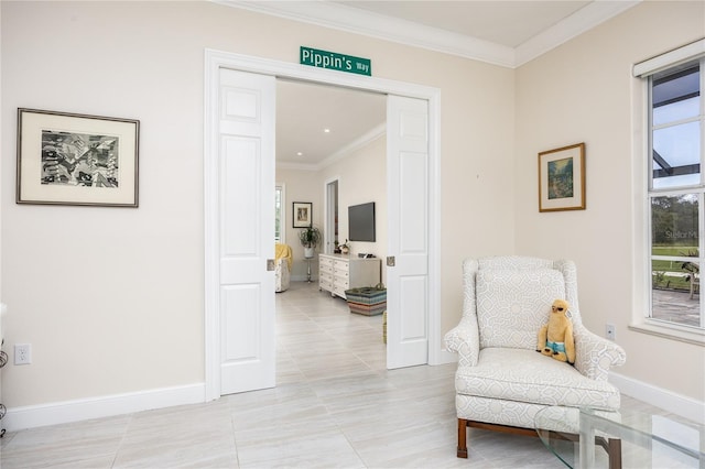 living area featuring light tile patterned floors and ornamental molding