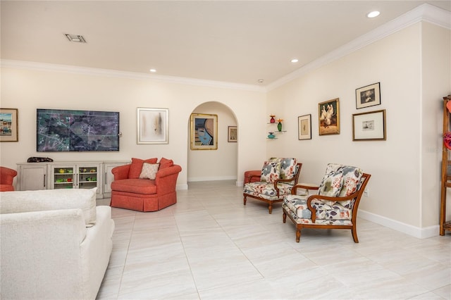 living room with ornamental molding and light tile patterned floors